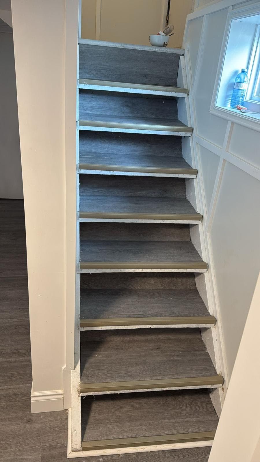 Basement stairs with new wood-look flooring, Barrie Ontario