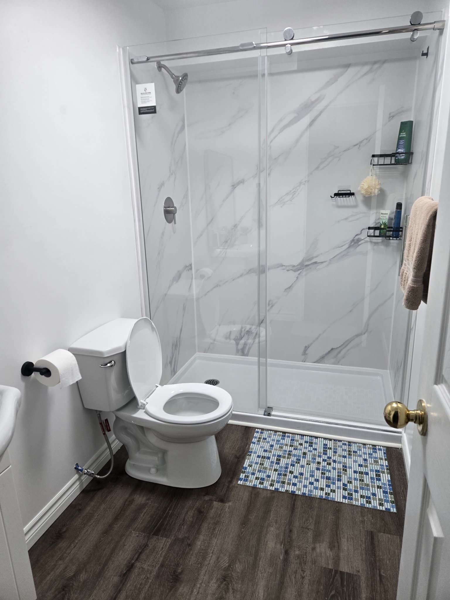 Completed bathroom renovation with glass shower, Barrie Ontario