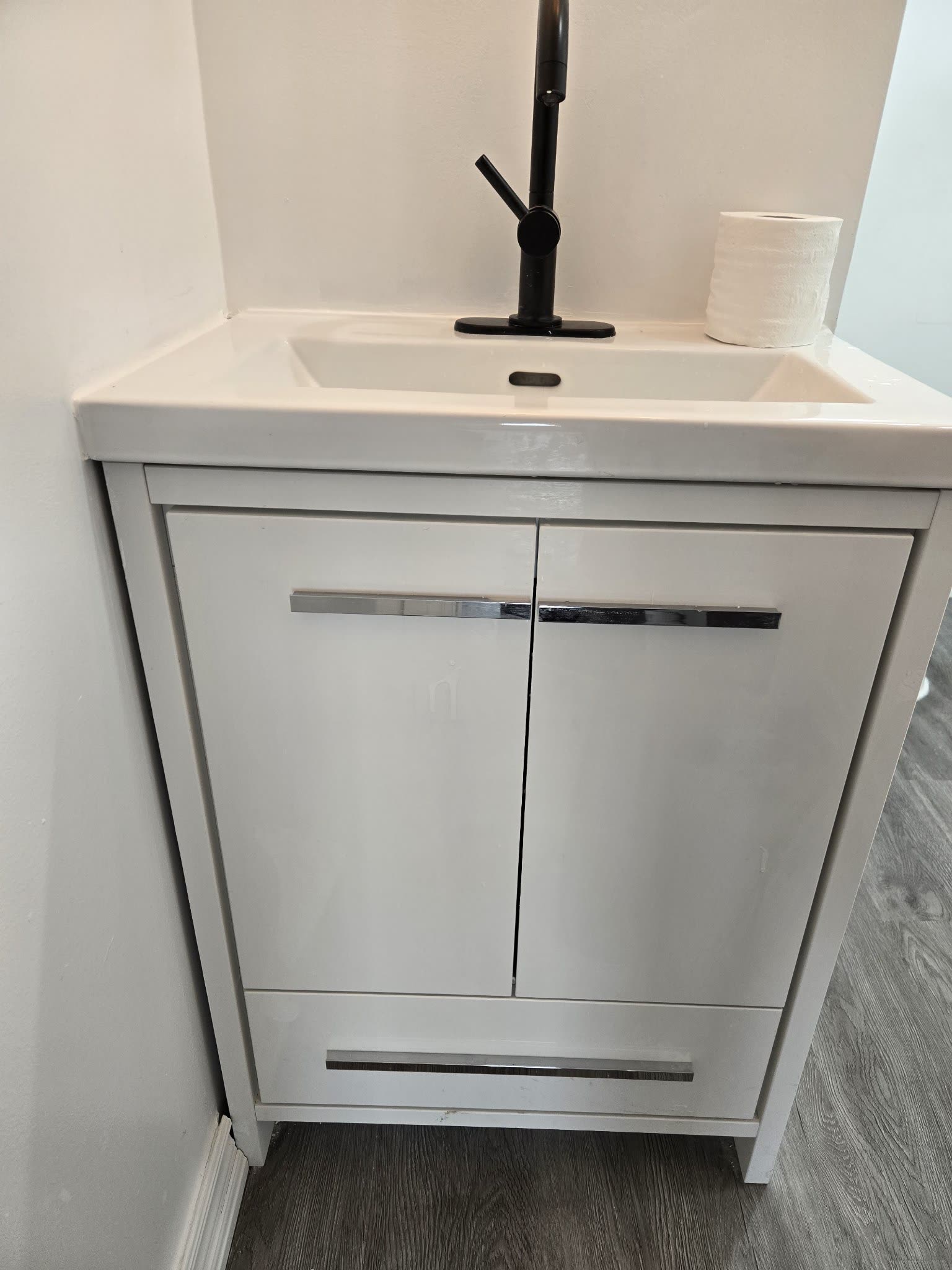 Bathroom vanity with black faucet and mirror, Barrie