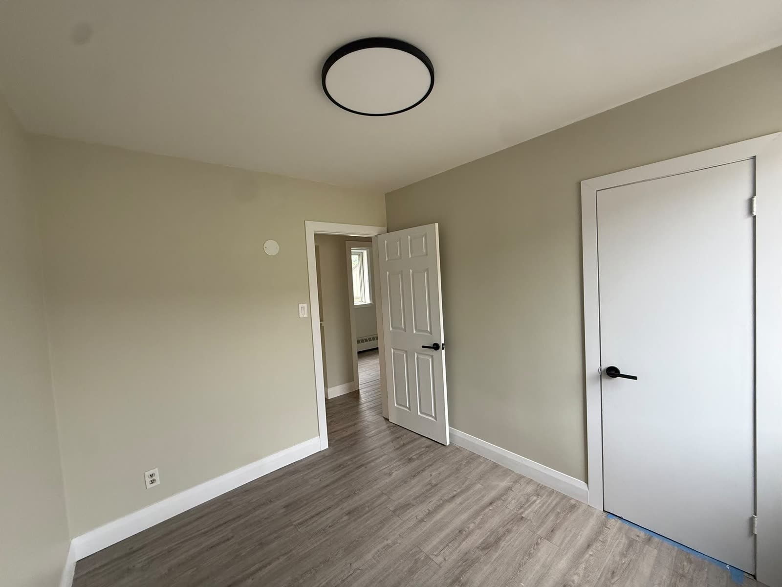 Bedroom renovation with modern ceiling light and flooring, Barrie