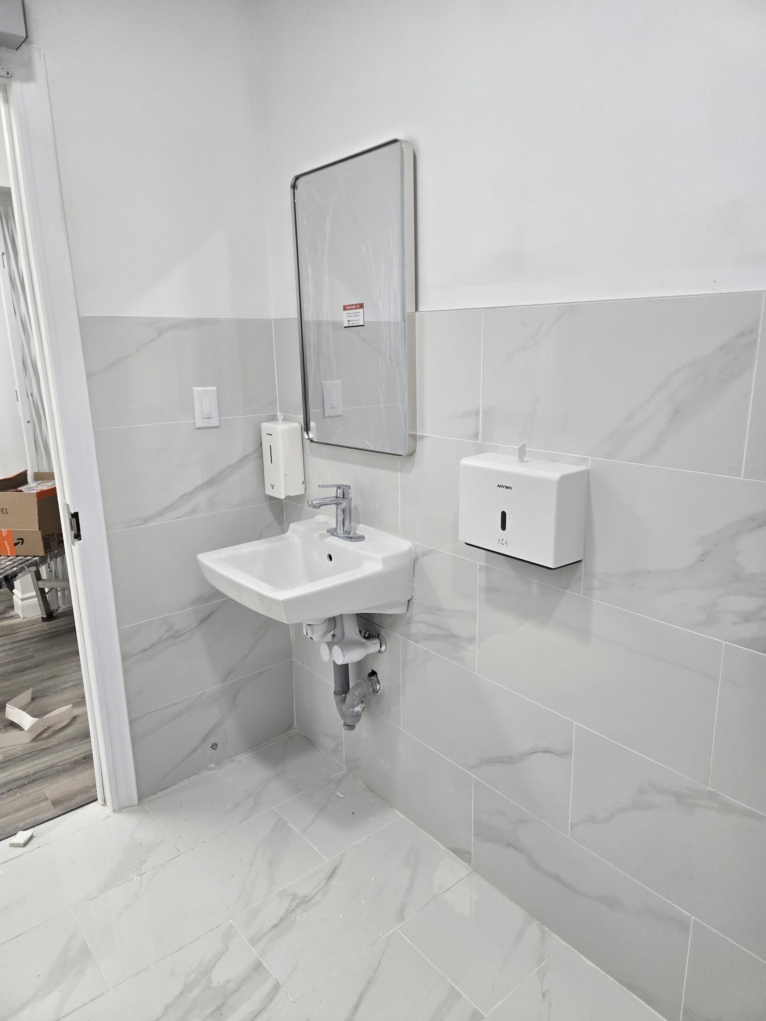 Commercial washroom sink with marble tile, Barrie Ontario