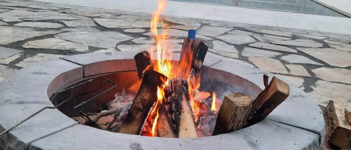 Stone fire pit burning at night, Barrie Ontario