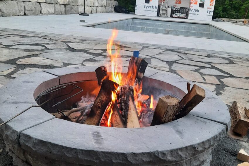 Stone fire pit burning at night, Barrie Ontario