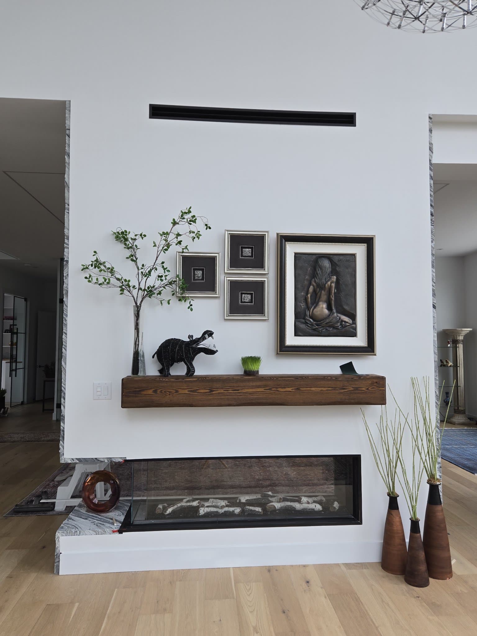 Modern fireplace with wood mantel, interior renovation Barrie