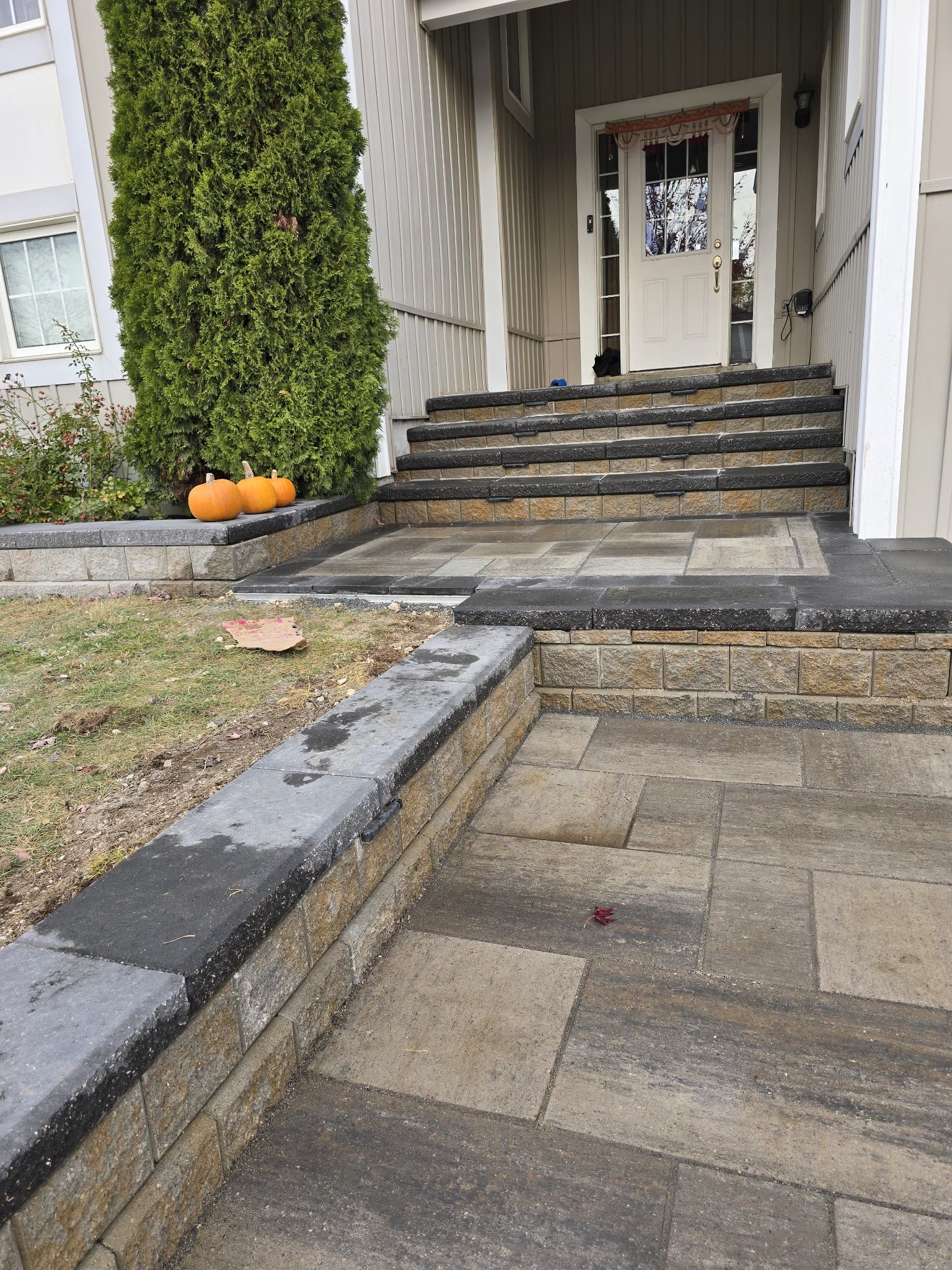 Front entrance steps with retaining wall and interlocking walkway, Barrie