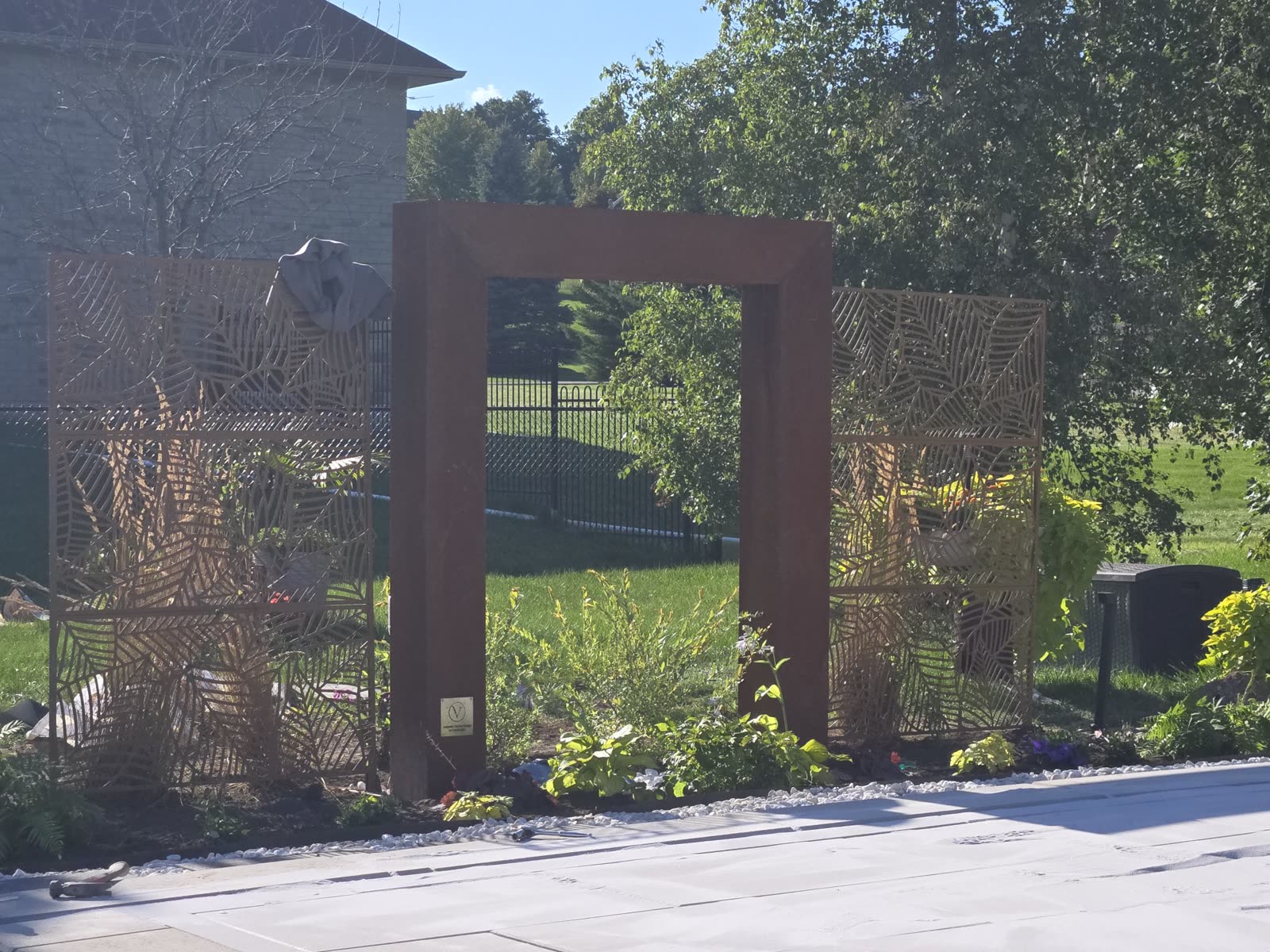 Decorative steel garden arch and privacy screens, Barrie landscaping