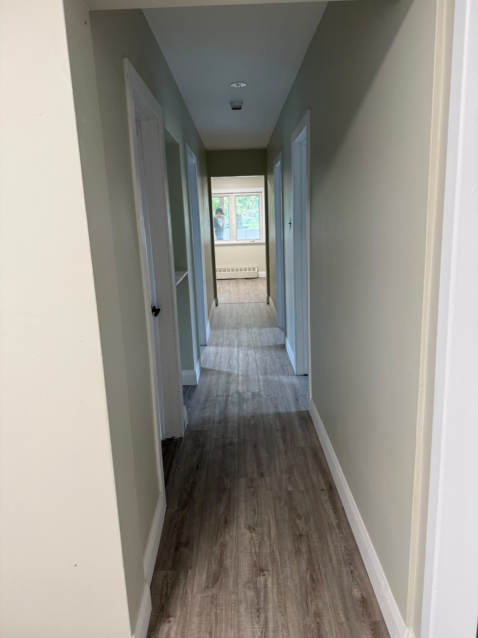 Hallway with new wood-look flooring, interior renovation Barrie