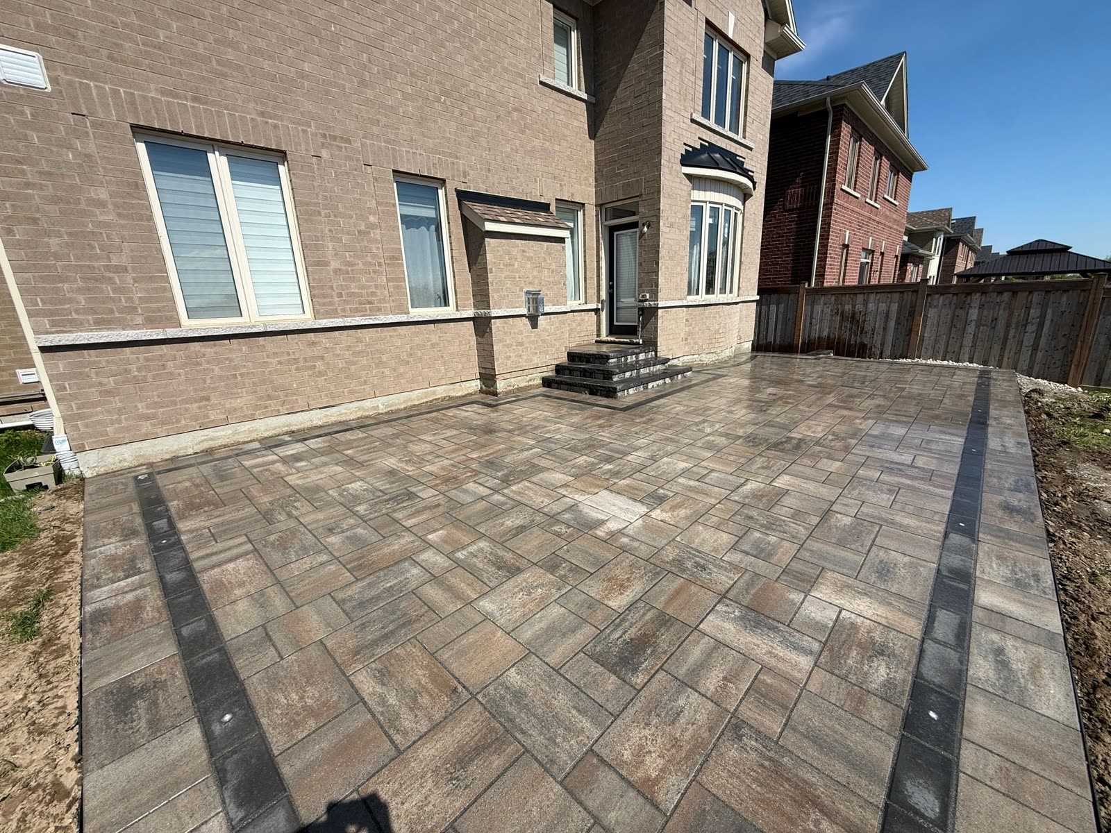 Interlocking patio with border inlay built by GDS Landscaping in Barrie