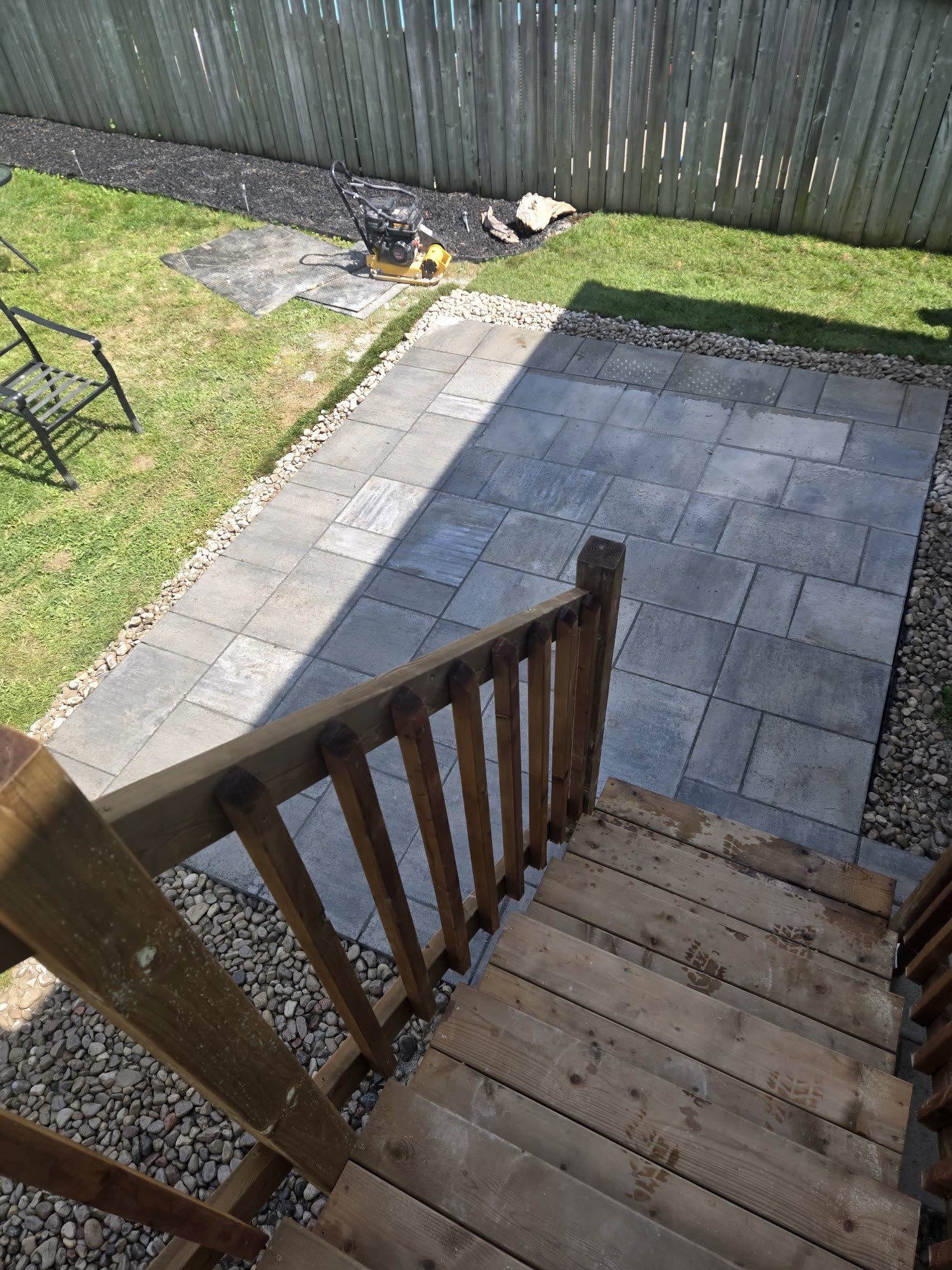Interlocking stone patio viewed from deck stairs, Barrie Ontario