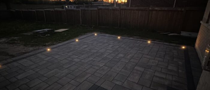 Interlocking patio and outdoor lighting at sunset