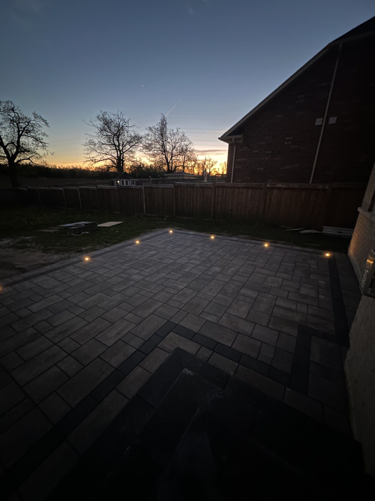 Interlocking patio and outdoor lighting at sunset