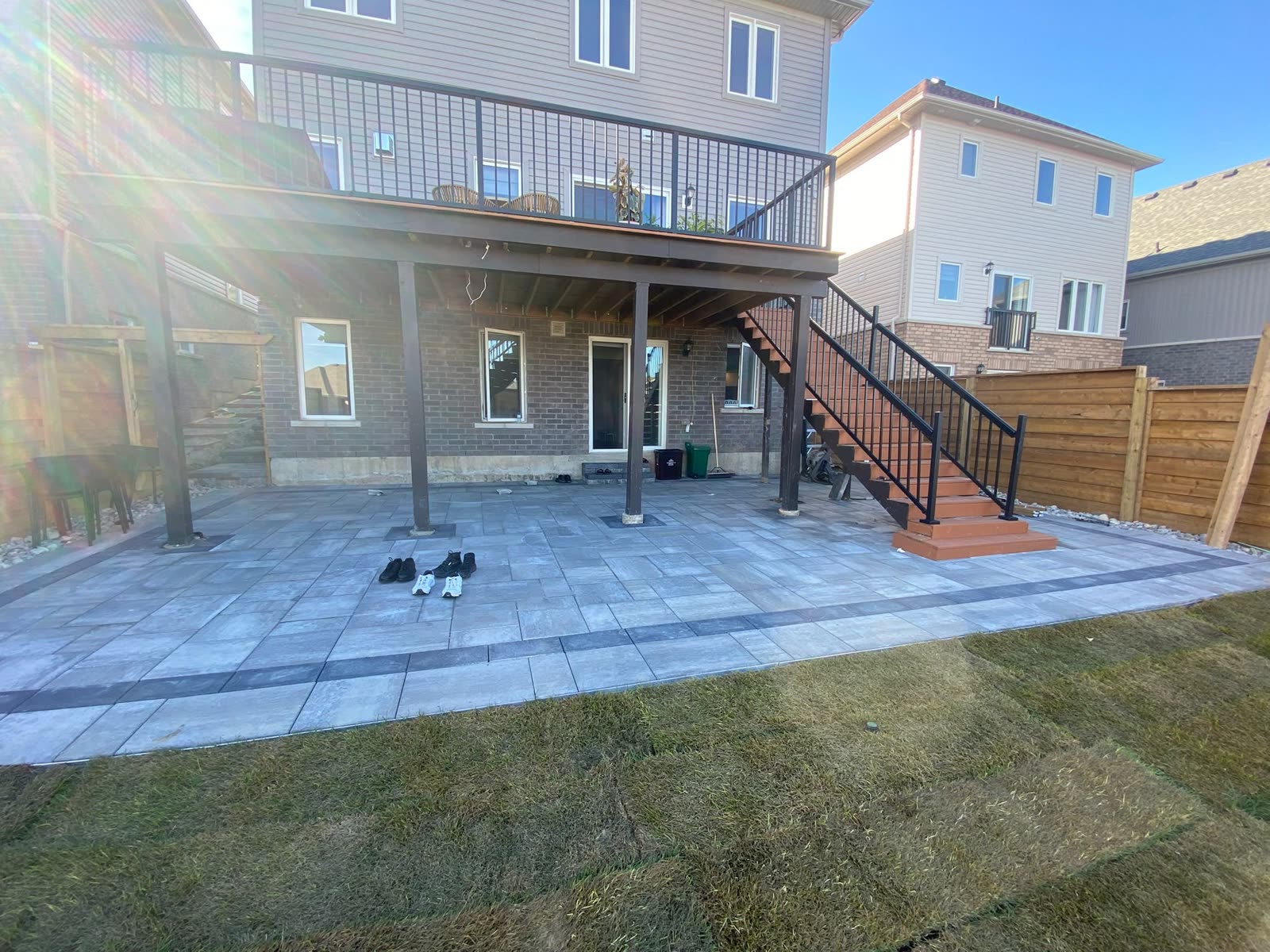 Interlocking patio under deck with new sod lawn, Barrie landscaping