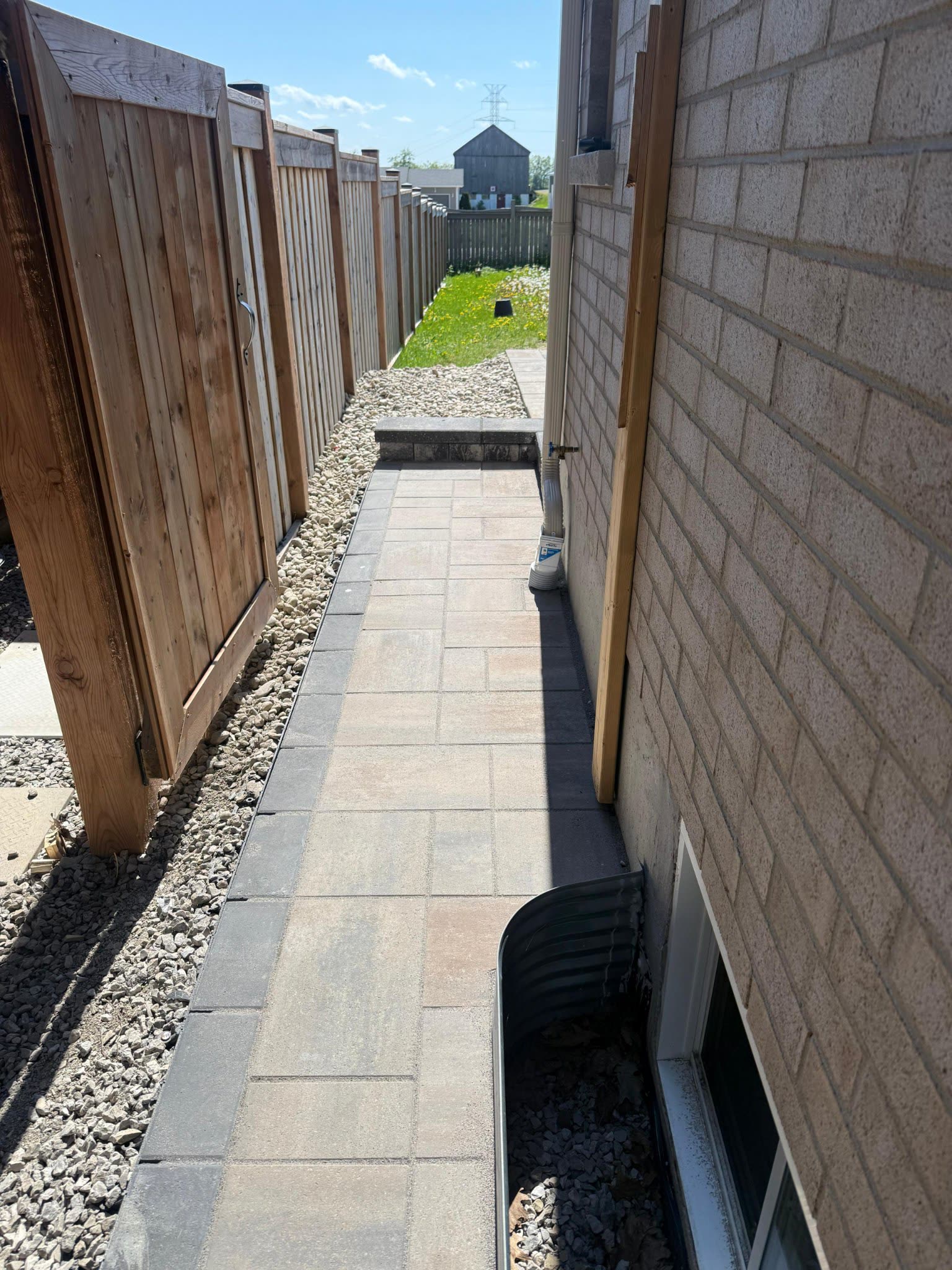 Interlocking walkway with stone border installed by GDS in Barrie