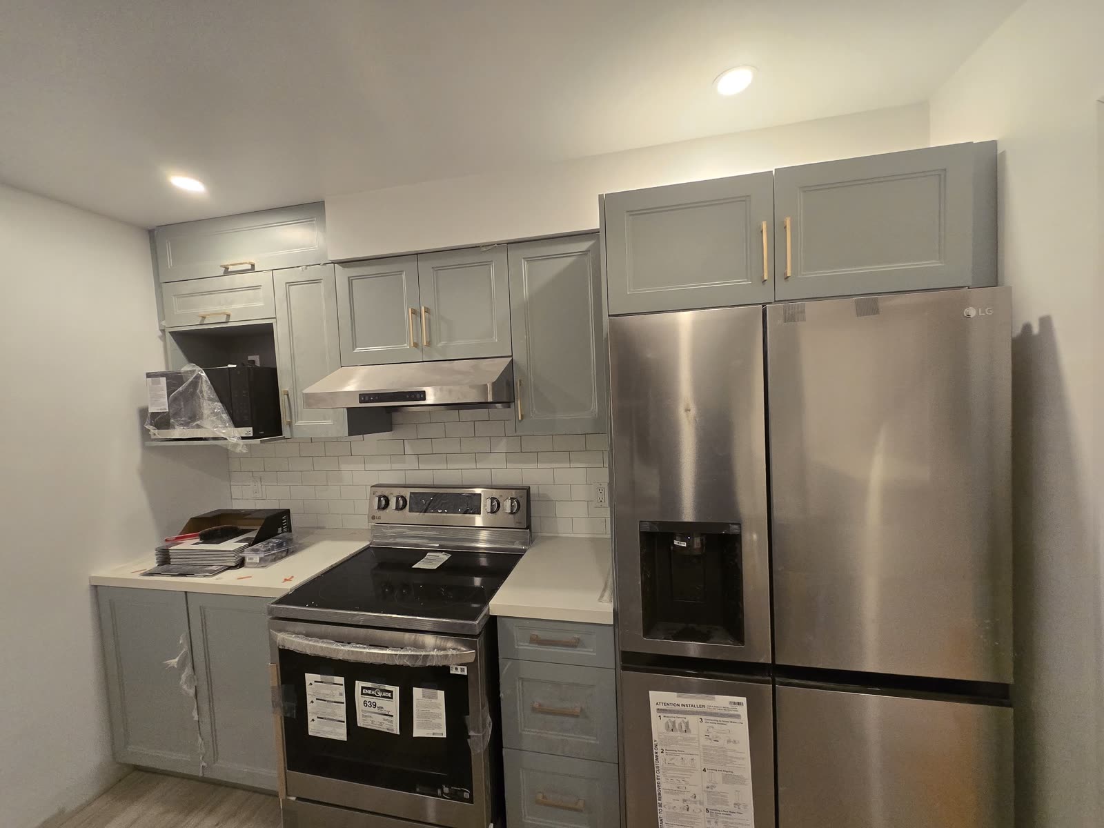 Grey kitchen renovation with white subway tile backsplash, Barrie