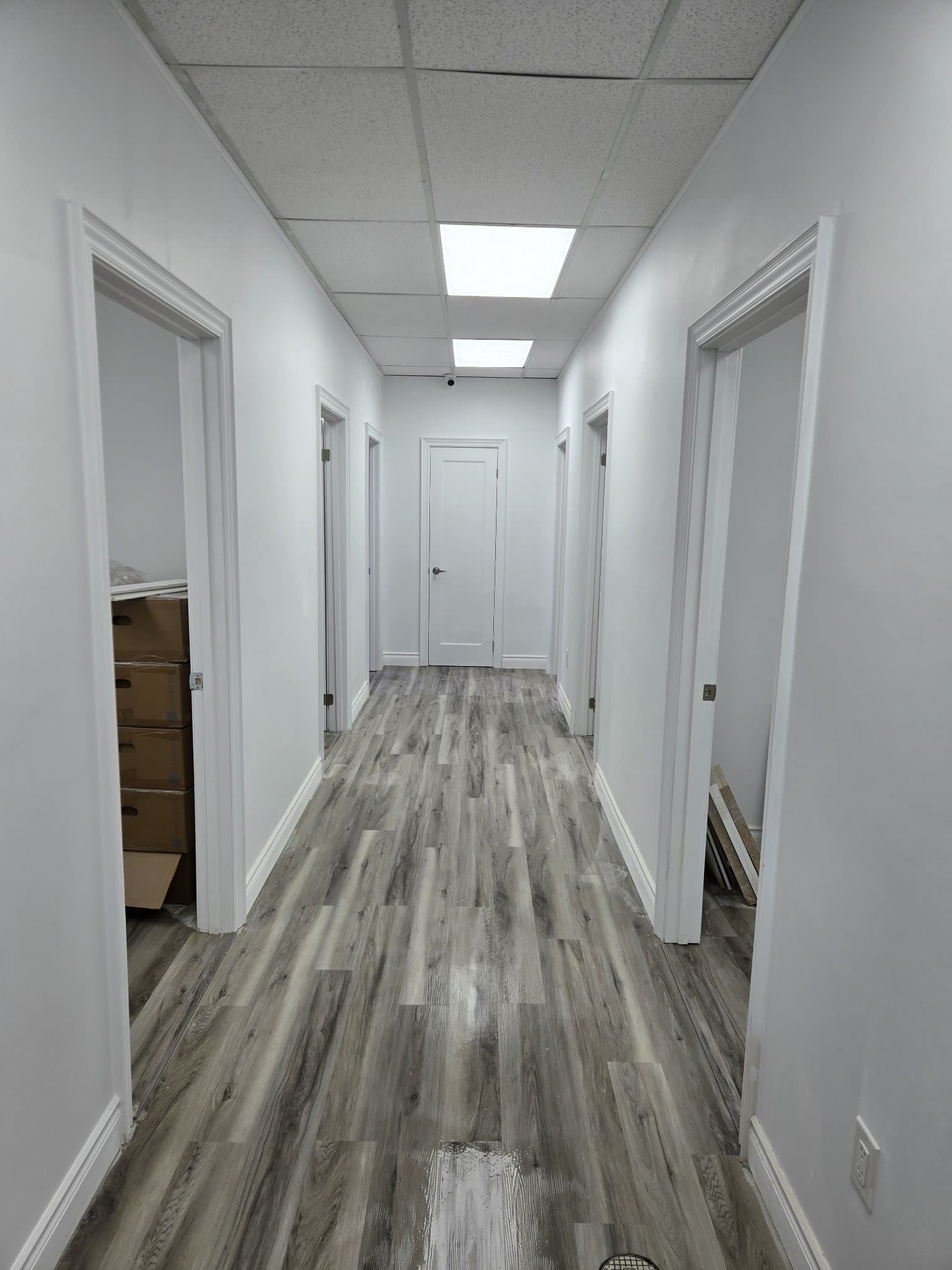 Office hallway with vinyl plank flooring, Barrie