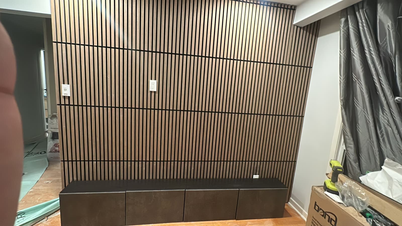 Wood slat accent wall with media console, living room Barrie
